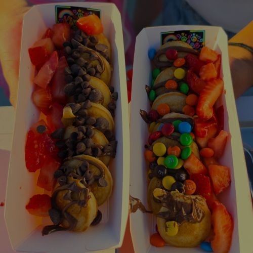 Mini Pancakes by Snack Sized Food Cart in Acton CA two plates of mini pancakes with fruit, candy, and syrup