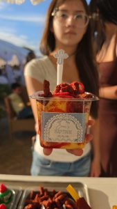 Young girl holding a Mangoneada made by Snack Sized Food Cart Dessert Catering Los Angeles County CA